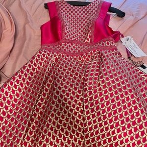 I never wore this dress it is brand new, still in the bag from the winner.